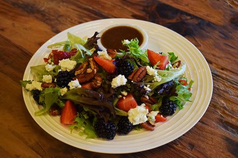 Mixed Greens with Seasonal Berries, Toasted Pecans, Goat Cheese and Honey Balsamic Dressing