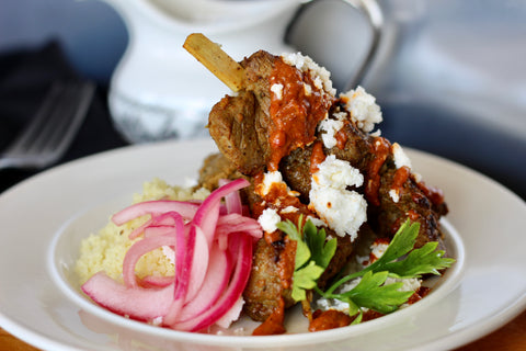 Mediterranean Beef Kebobs over Couscous, Pickled Red Onions, Feta and Harissa