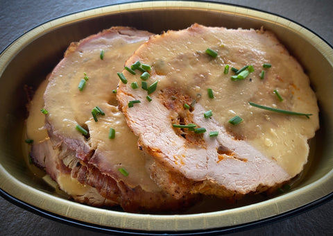 Stuffed Pork Loin with Chorizo, Manchego Cheese and Cider Jus